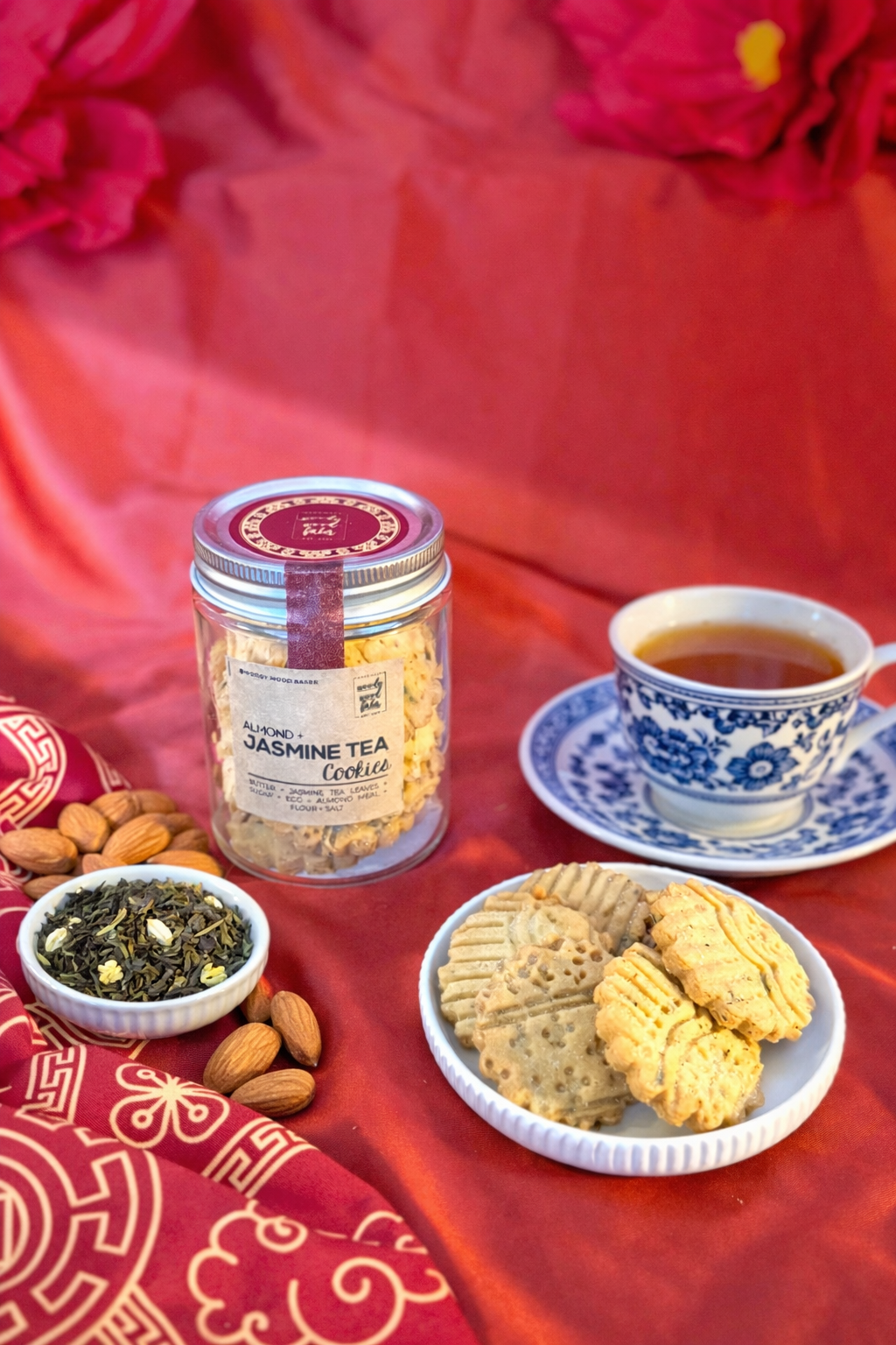 Almond jasmine butter cookies infused with jasmine tea leaves in glass jar